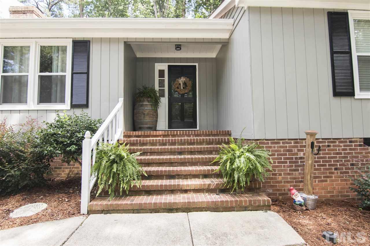7408 Post Oak Road Raleigh, NC 27615 - Photo 3 of 27 a view of a entrance door of the house