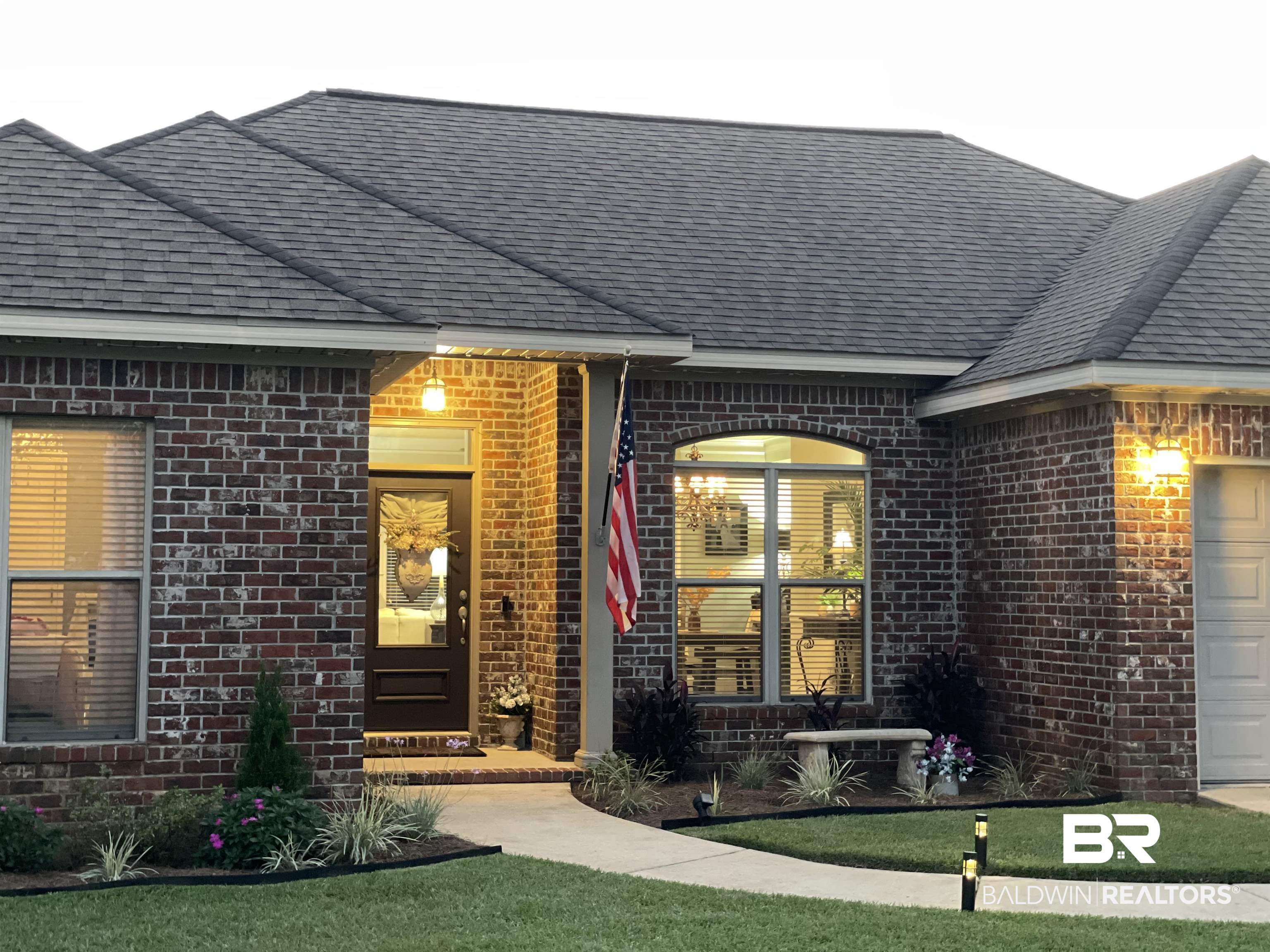 9376 Sable Court Daphne, AL 36526 - Photo 43 of 46 Exterior space with a garage and a front lawn