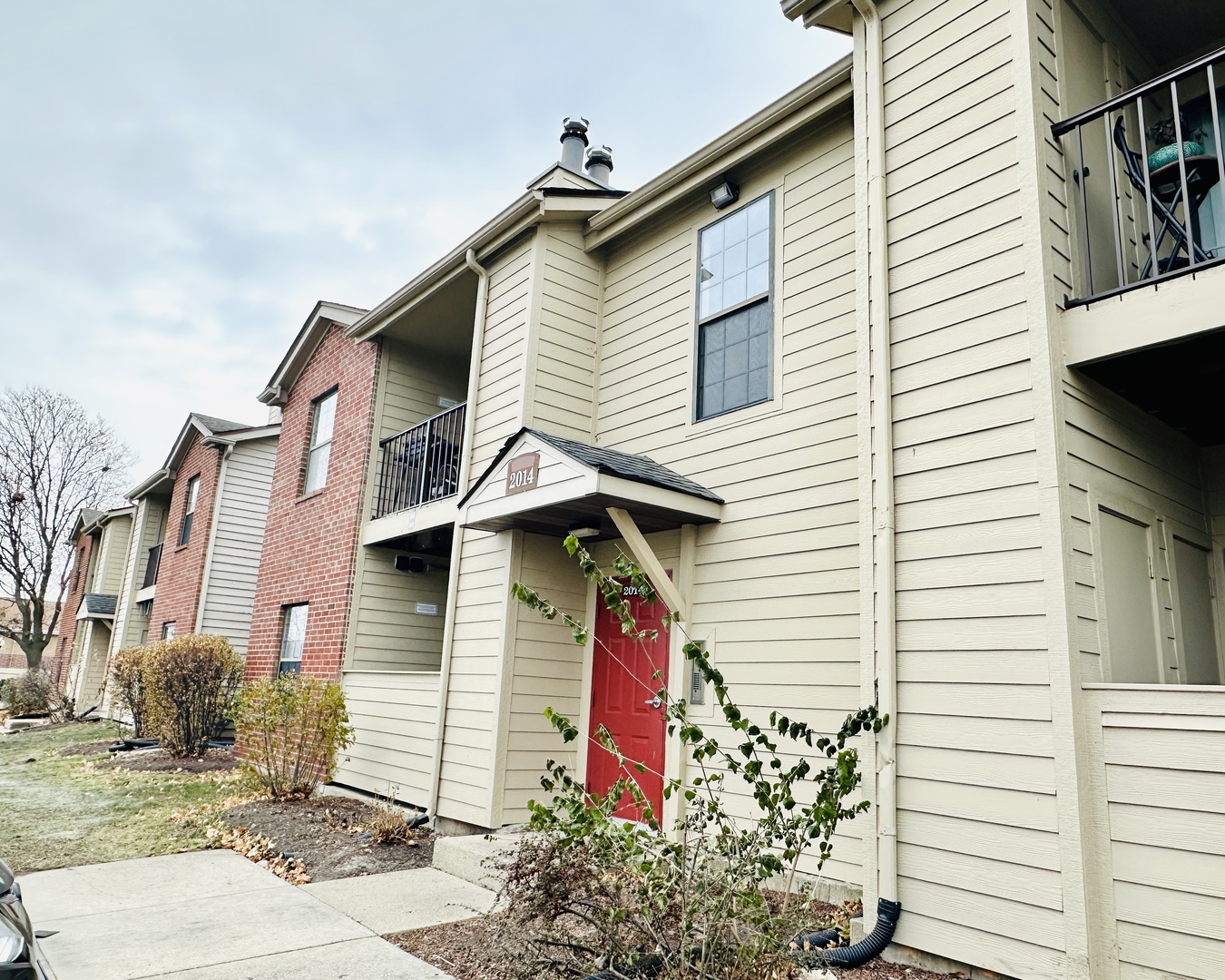 2014 North Rand Road, Unit 108 Palatine, IL 60074 - Photo 1 of 16 a view of a house with a yard