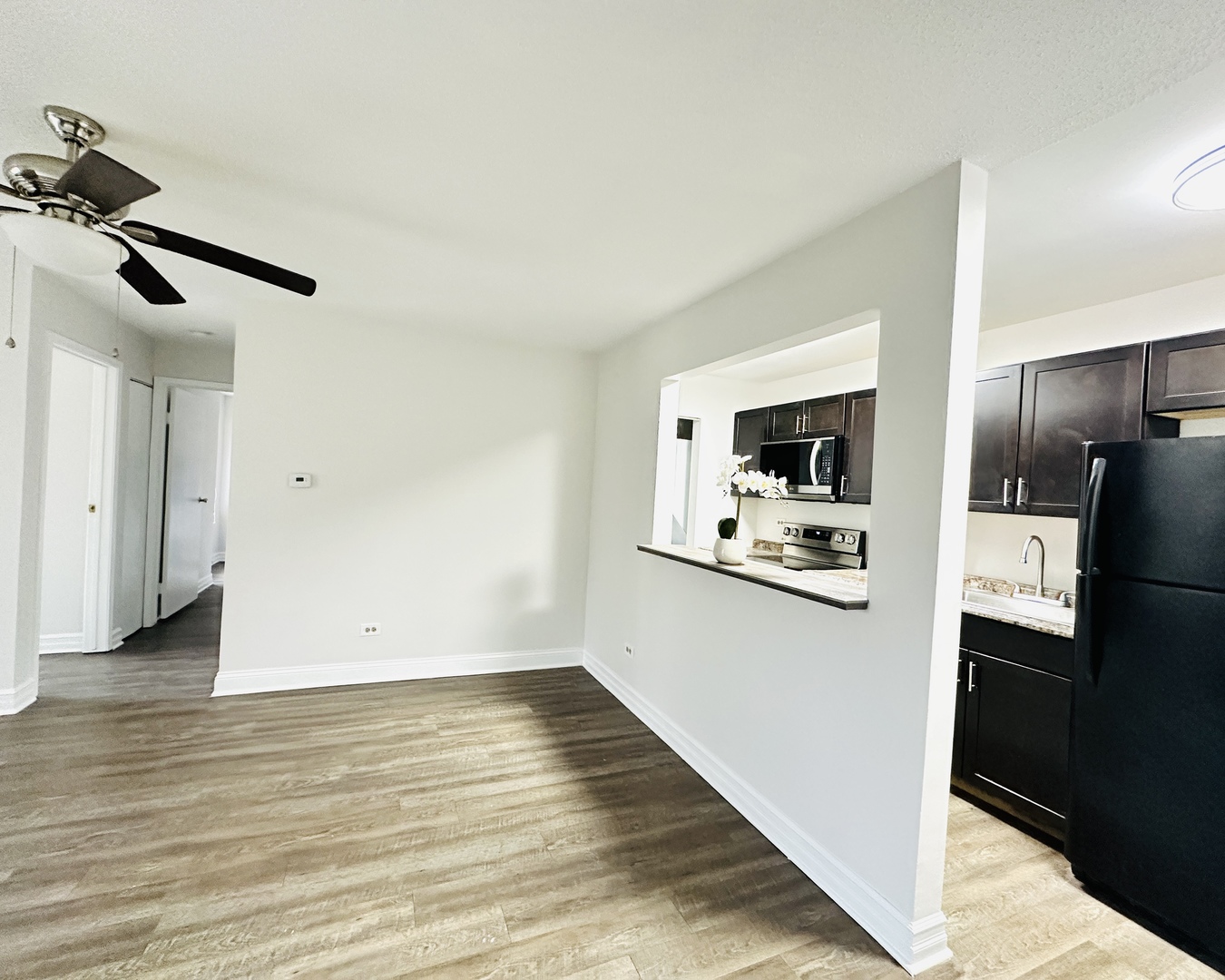 2014 North Rand Road, Unit 108 Palatine, IL 60074 - Photo 3 of 16 a view of a kitchen from the hallway