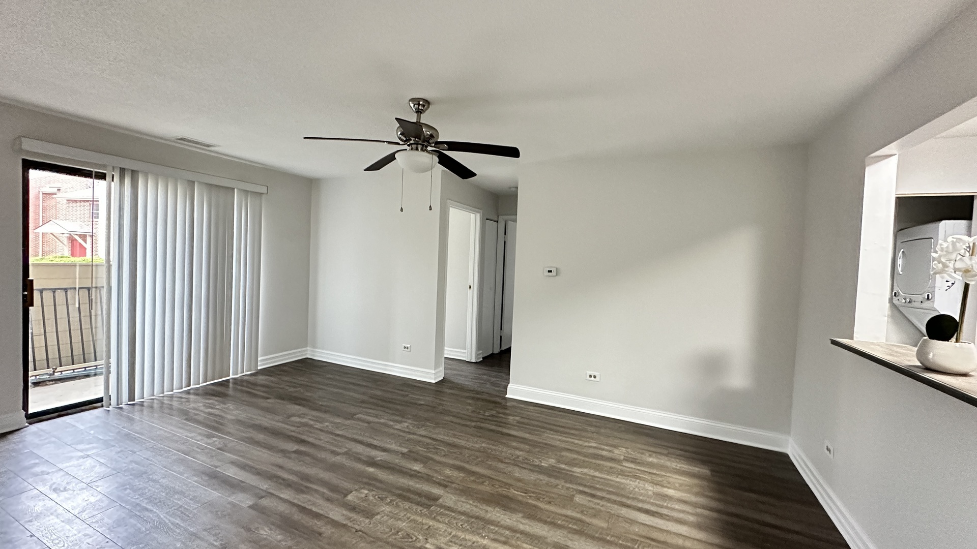 2014 North Rand Road, Unit 108 Palatine, IL 60074 - Photo 4 of 16 wooden floor in an empty room with a window