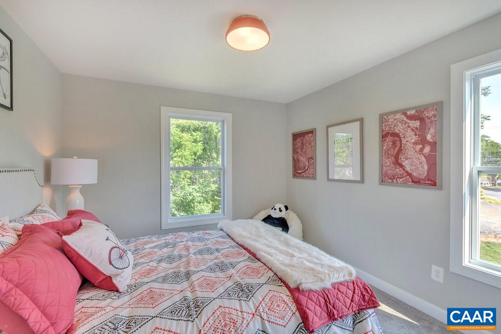 133 Junction Lane Charlottesville, VA 22902 - Photo 14 of 24 a bedroom with a bed and a window