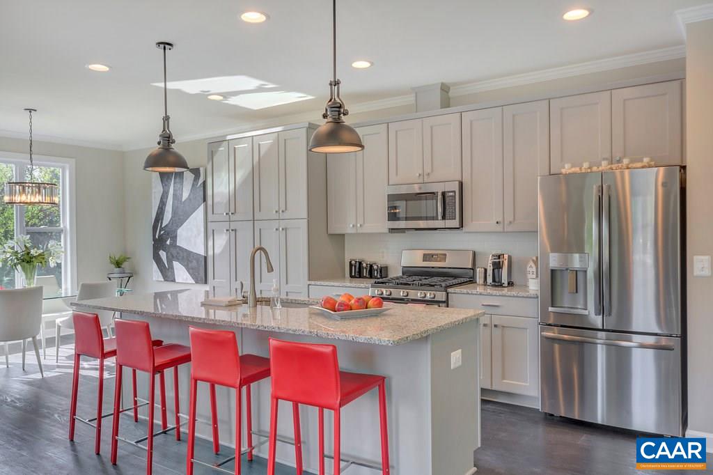 133 Junction Lane Charlottesville, VA 22902 - Photo 6 of 24 a kitchen with refrigerator a sink and chairs