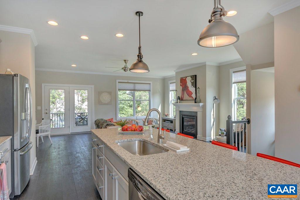 133 Junction Lane Charlottesville, VA 22902 - Photo 7 of 24 a very nice looking kitchen with granite countertop a stove and large cabinets