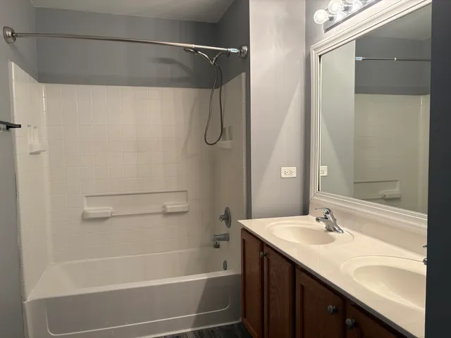 a white toilet sitting next to a white wall