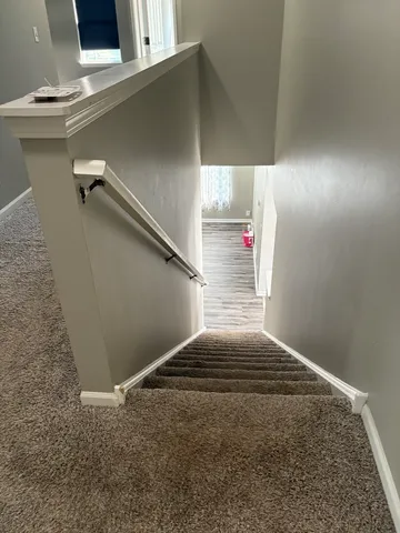a view of a room with wooden walls