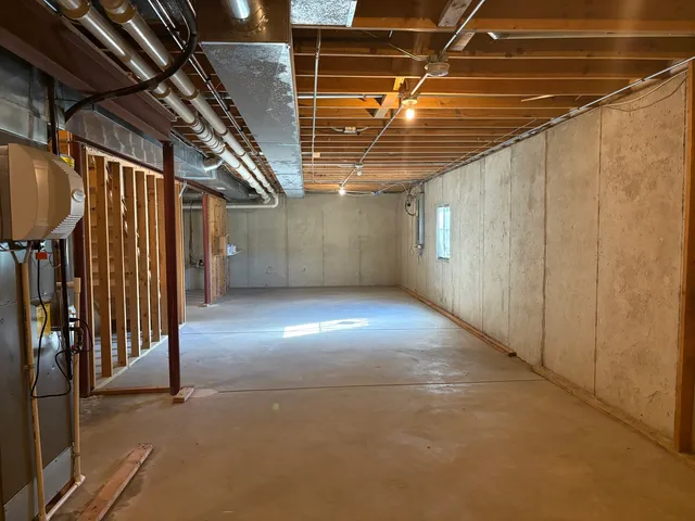 a kitchen with refrigerator and table