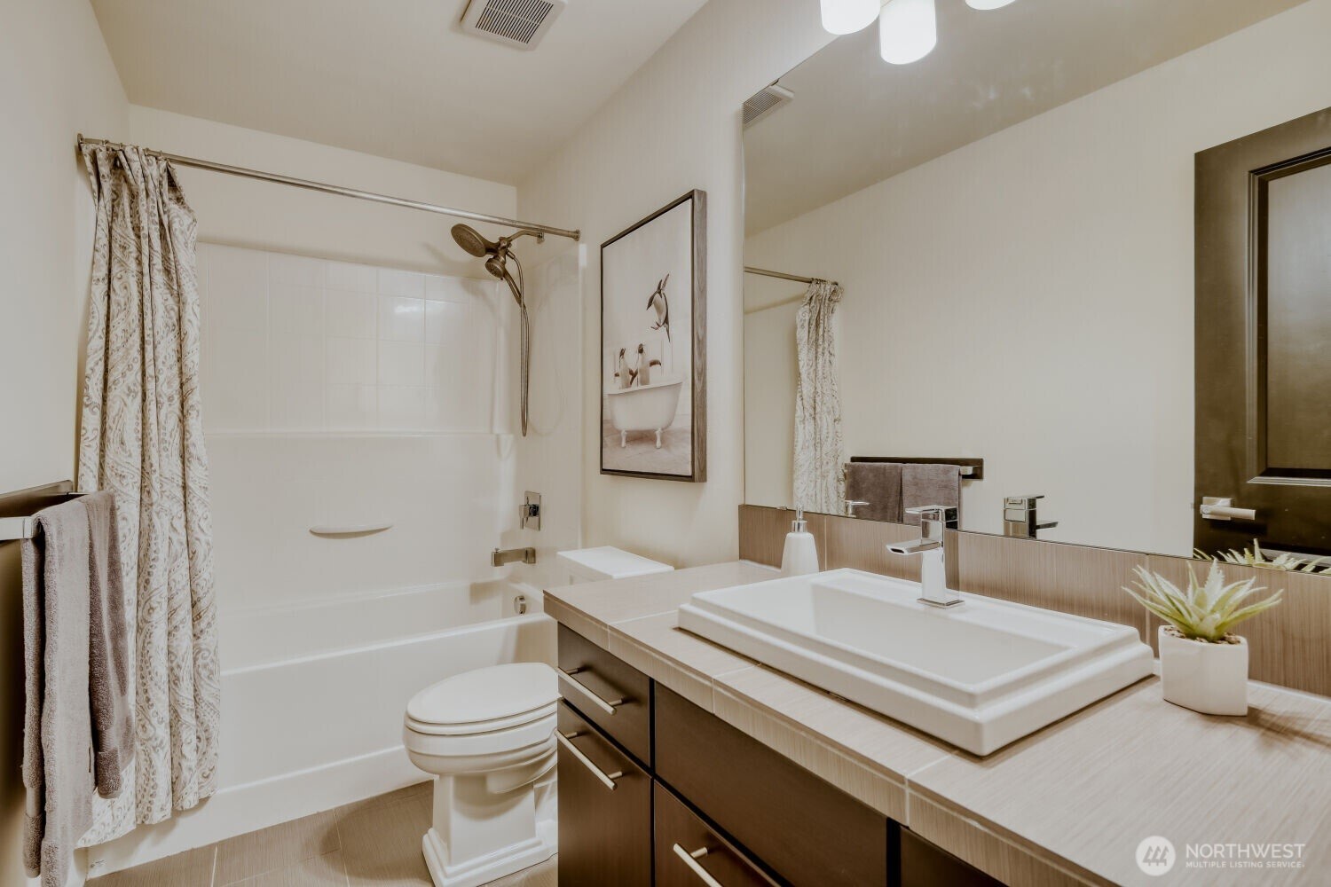 1900 240th Place Southwest Bothell, WA 98021 - Photo 11 of 12 a view of bathroom with a tub shower vanity and a sink