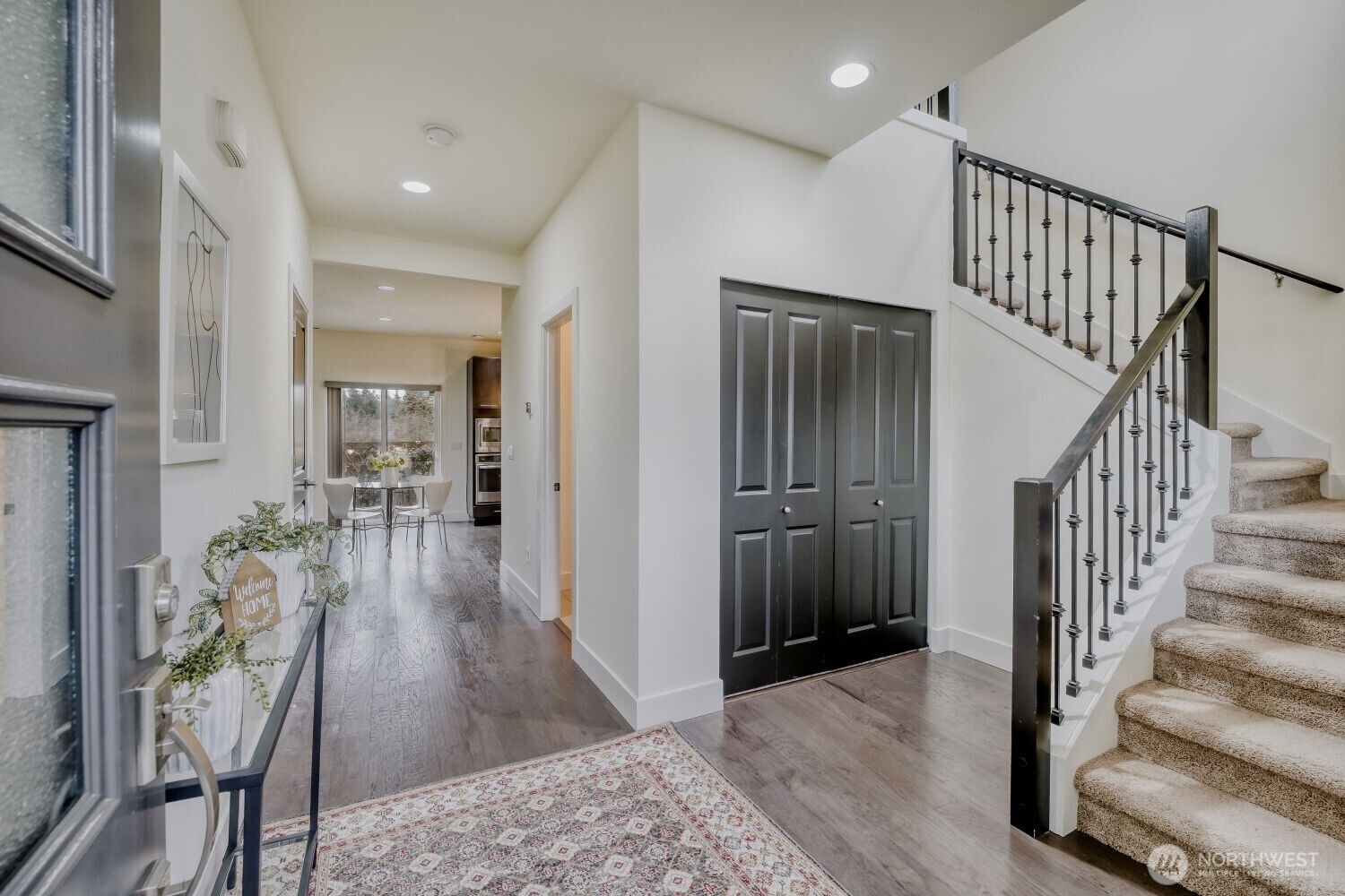 1900 240th Place Southwest Bothell, WA 98021 - Photo 2 of 12 a view of a hallway with wooden floor and stairs