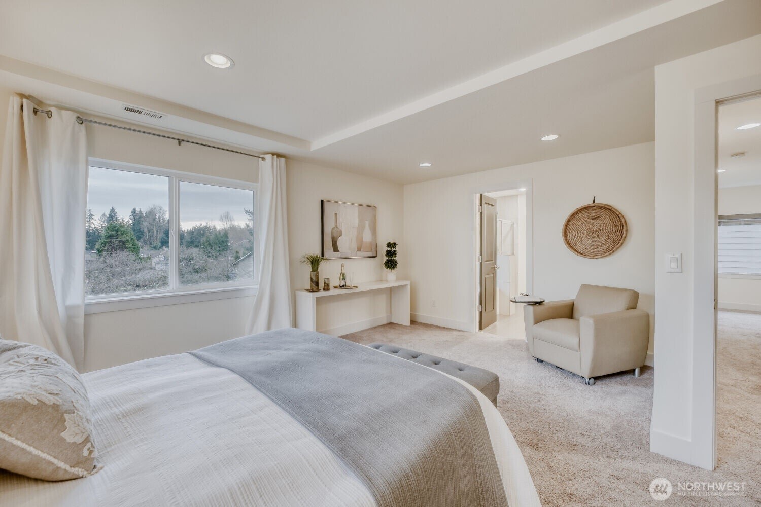 1900 240th Place Southwest Bothell, WA 98021 - Photo 6 of 12 a spacious bedroom with a bed and a large window