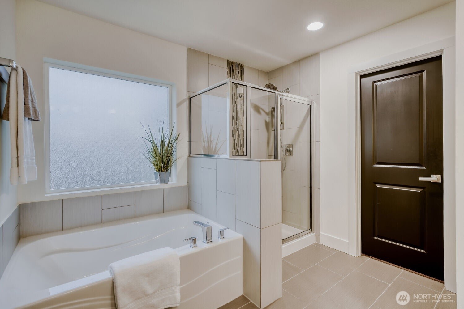 1900 240th Place Southwest Bothell, WA 98021 - Photo 8 of 12 a bathroom with a tub shower and vanity