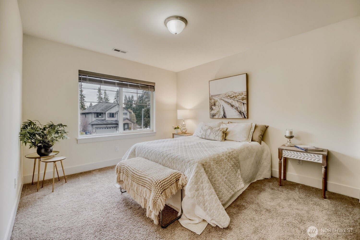 1900 240th Place Southwest Bothell, WA 98021 - Photo 9 of 12 a spacious bedroom with a bed and a painting on the wall