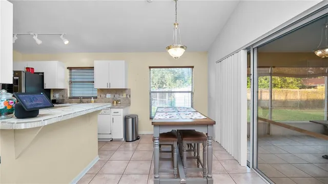 a kitchen with a sink a counter top space and appliances