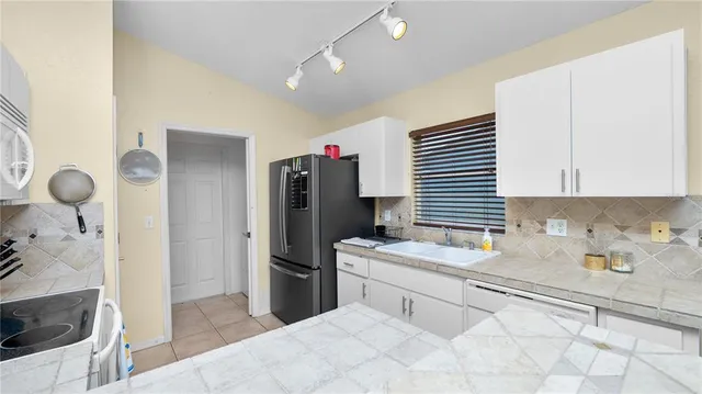 a bedroom with a bed and a sink