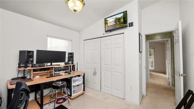 a view of a workspace with furniture