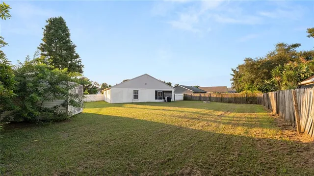 a view of a house with a big yard