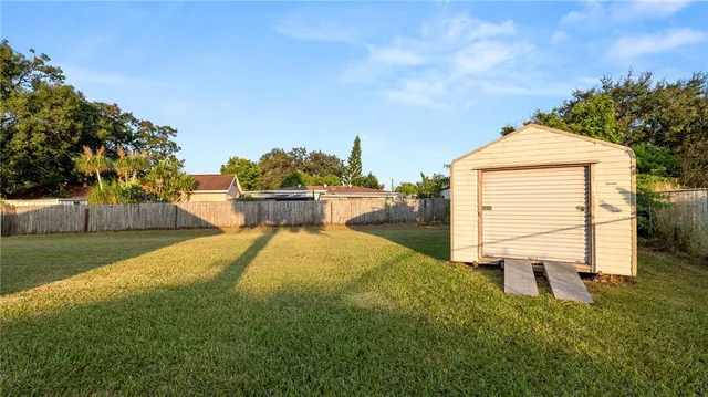 a view of a backyard of the house