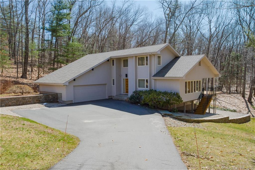 45 Pine Hill Road Avon, CT 06001 - Photo 1 of 1 a front view of a house with a yard