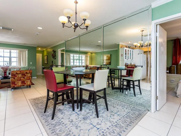 a kitchen with granite countertop a white stove top oven and cabinets
