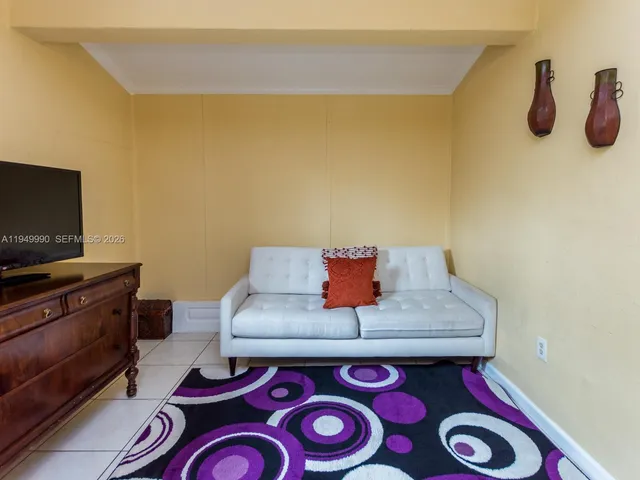 a bathroom with a bathtub and shower curtain