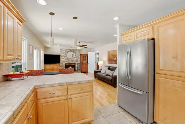 a living room with furniture fireplace and flat screen tv