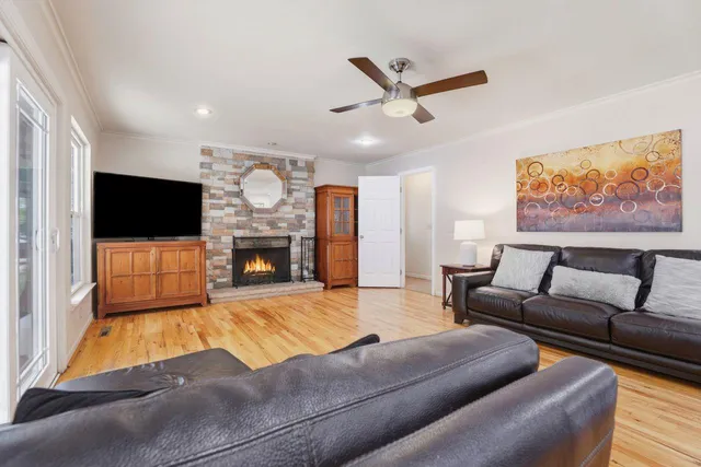 a living room with furniture and kitchen view