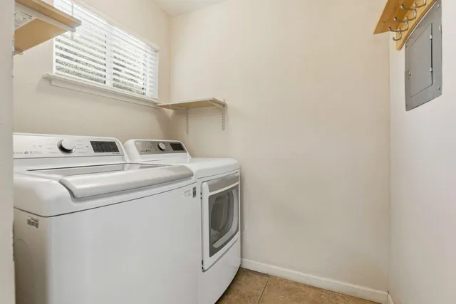 a bedroom with a large bed and a large window