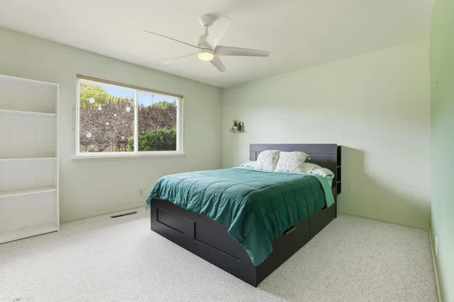 a bathroom with a sink toilet vanity and shower