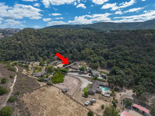 a view of a lake with a yard