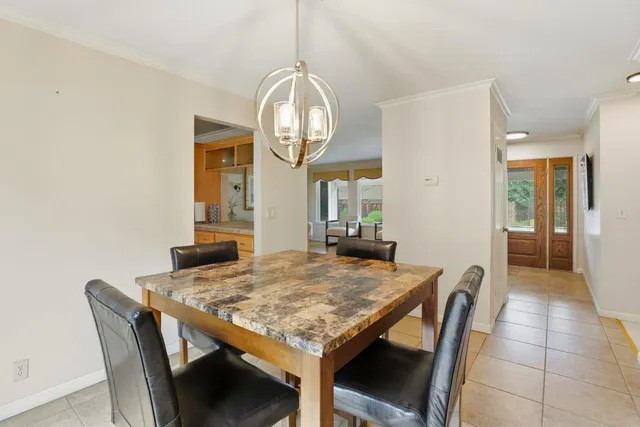 a kitchen with sink stove and cabinets