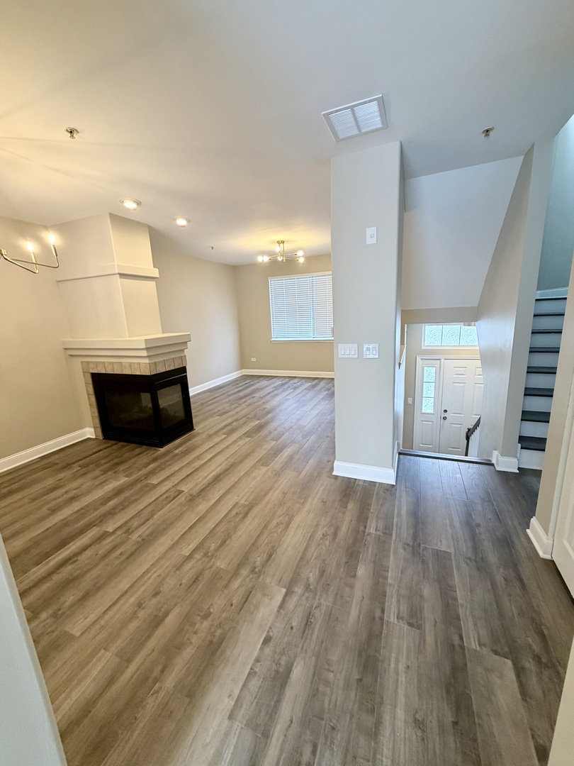 10233 Concord Lane, Unit C Bridgeview, IL 60455 - Photo 5 of 23 a view of a room and wooden floor