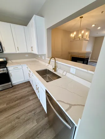 a kitchen with a sink and cabinets