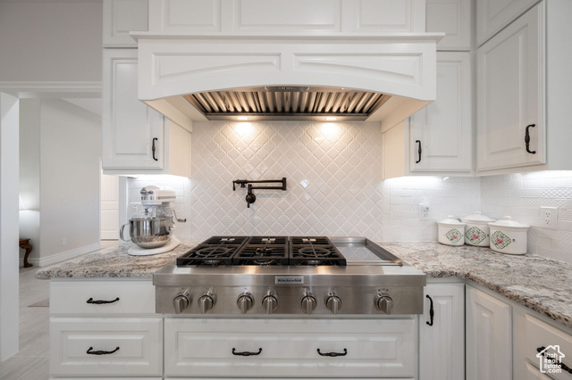 230 Boulder Way Leeds, UT 84746 - Photo 12 of 72 Main Kitchen featuring tile backsplash, stainless steel gas 48" cook-top, custom exhaust hood, and white soft-close cabinets