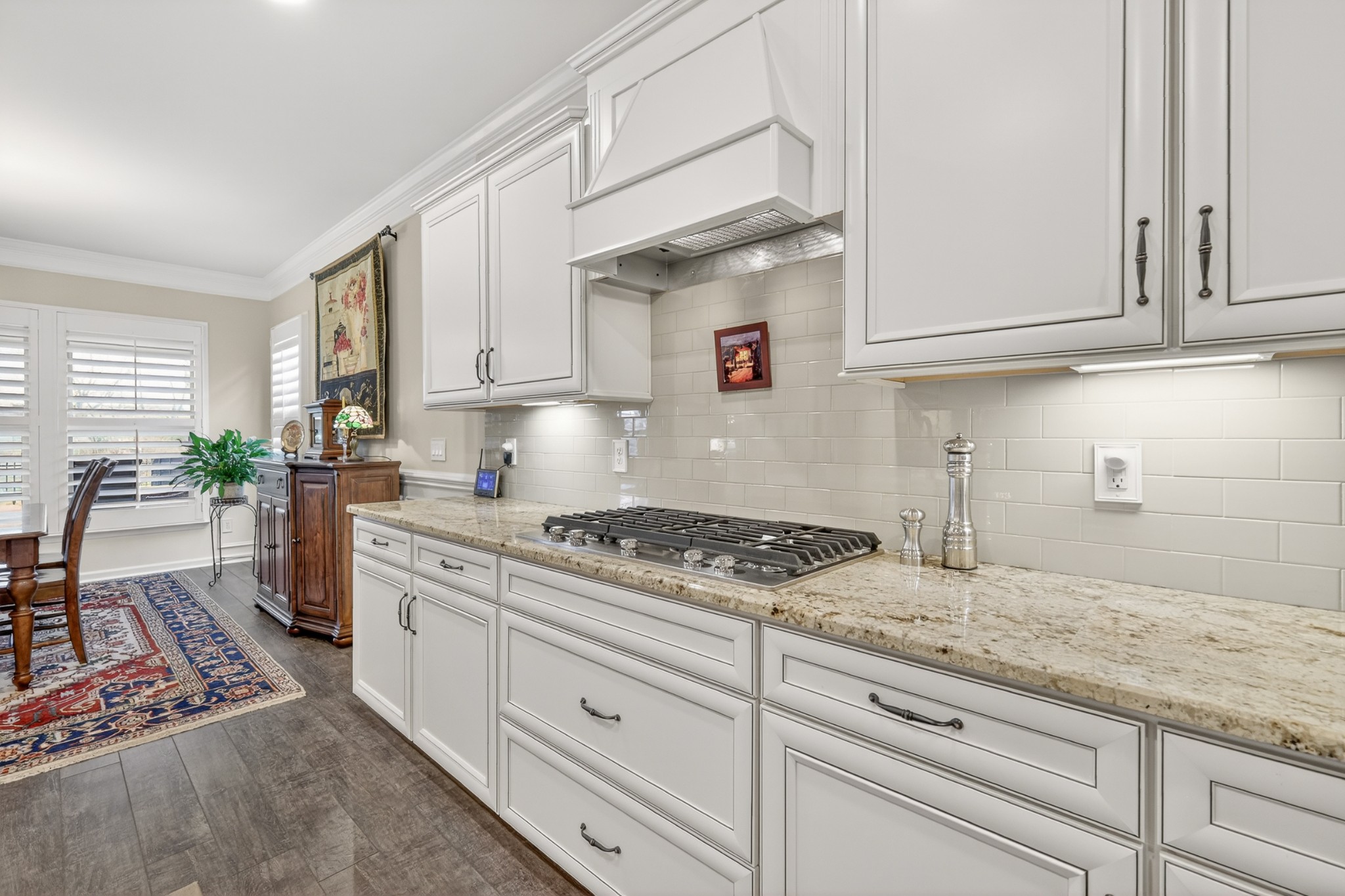 1024 Coffee Ridge Spring Hill, TN 37174 - Photo 16 of 46 a kitchen with granite countertop white cabinets and white appliances