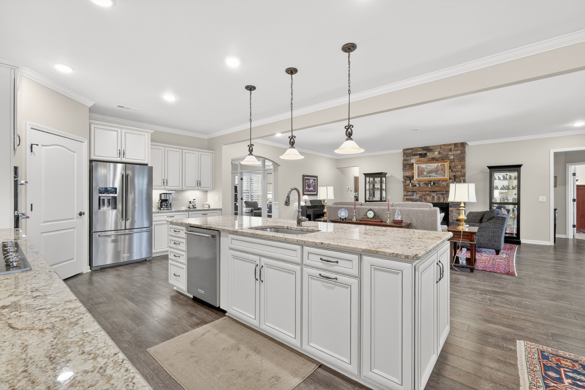 1024 Coffee Ridge Spring Hill, TN 37174 - Photo 17 of 46 a kitchen with stainless steel appliances kitchen island granite countertop a sink and refrigerator