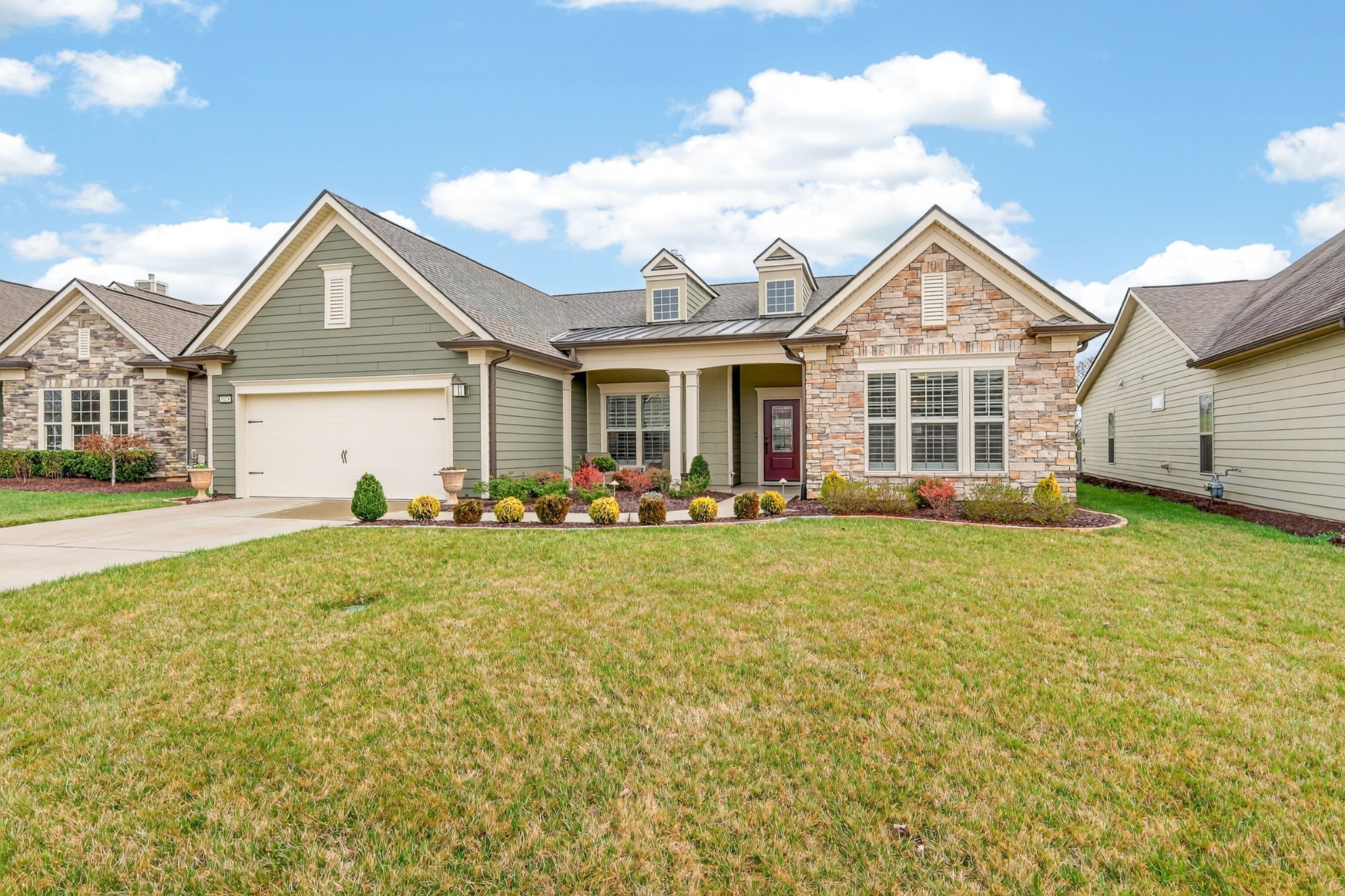 1024 Coffee Ridge Spring Hill, TN 37174 - Photo 2 of 46 a view of a house with a yard and potted plants