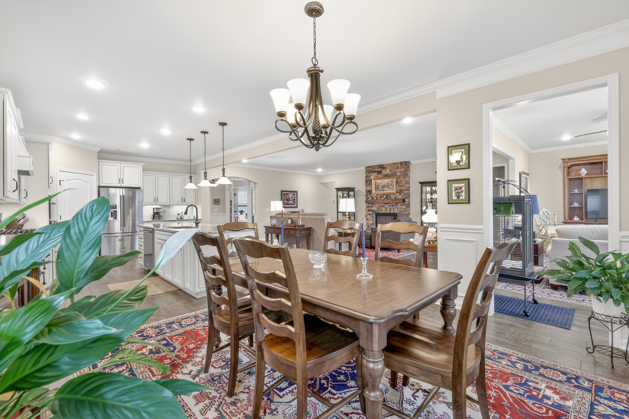 1024 Coffee Ridge Spring Hill, TN 37174 - Photo 21 of 46 a view of a dining room and livingroom with furniture wooden floor a chandelier