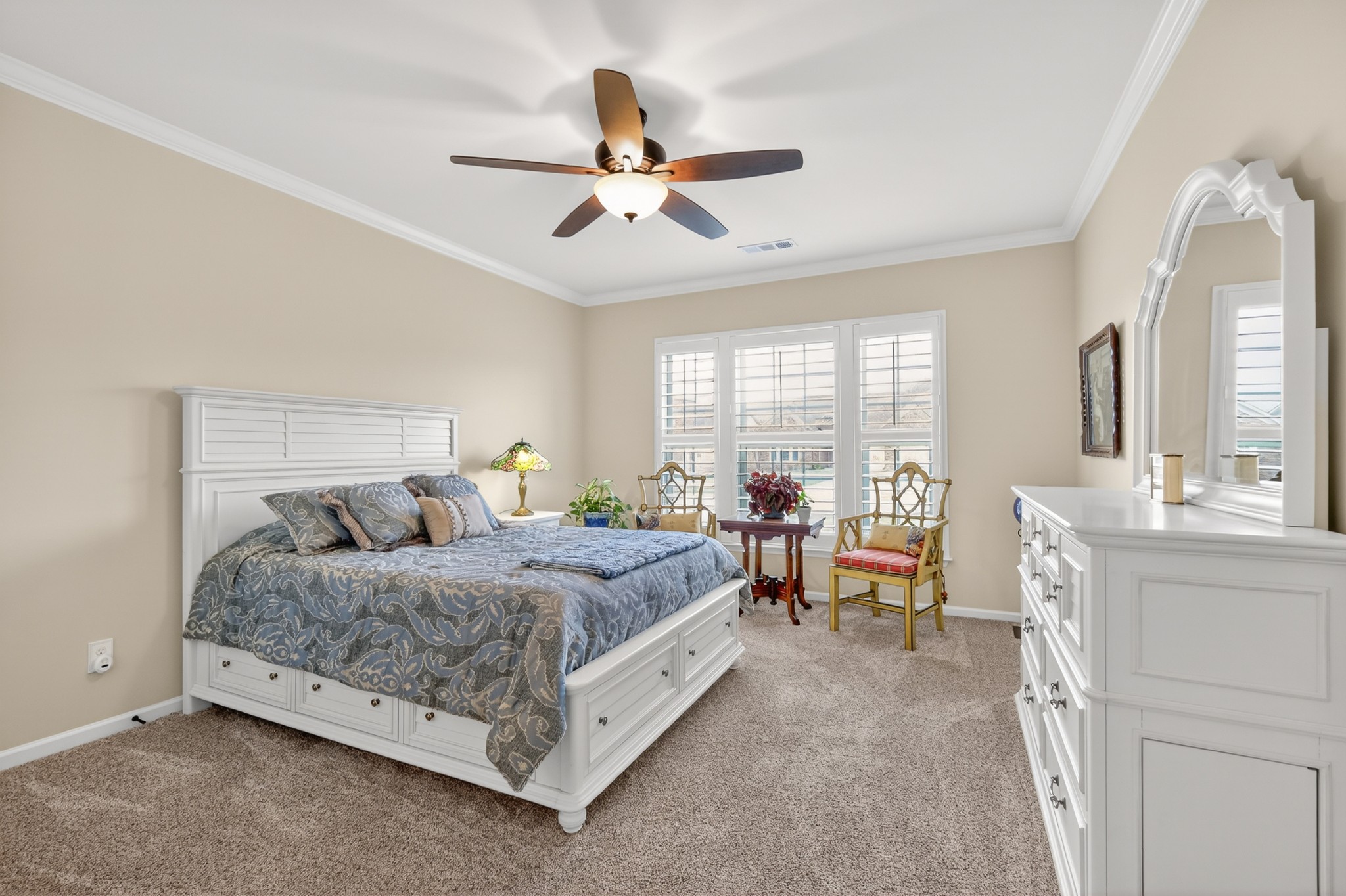 1024 Coffee Ridge Spring Hill, TN 37174 - Photo 22 of 46 a bedroom with a bed and a large mirror with a dresser