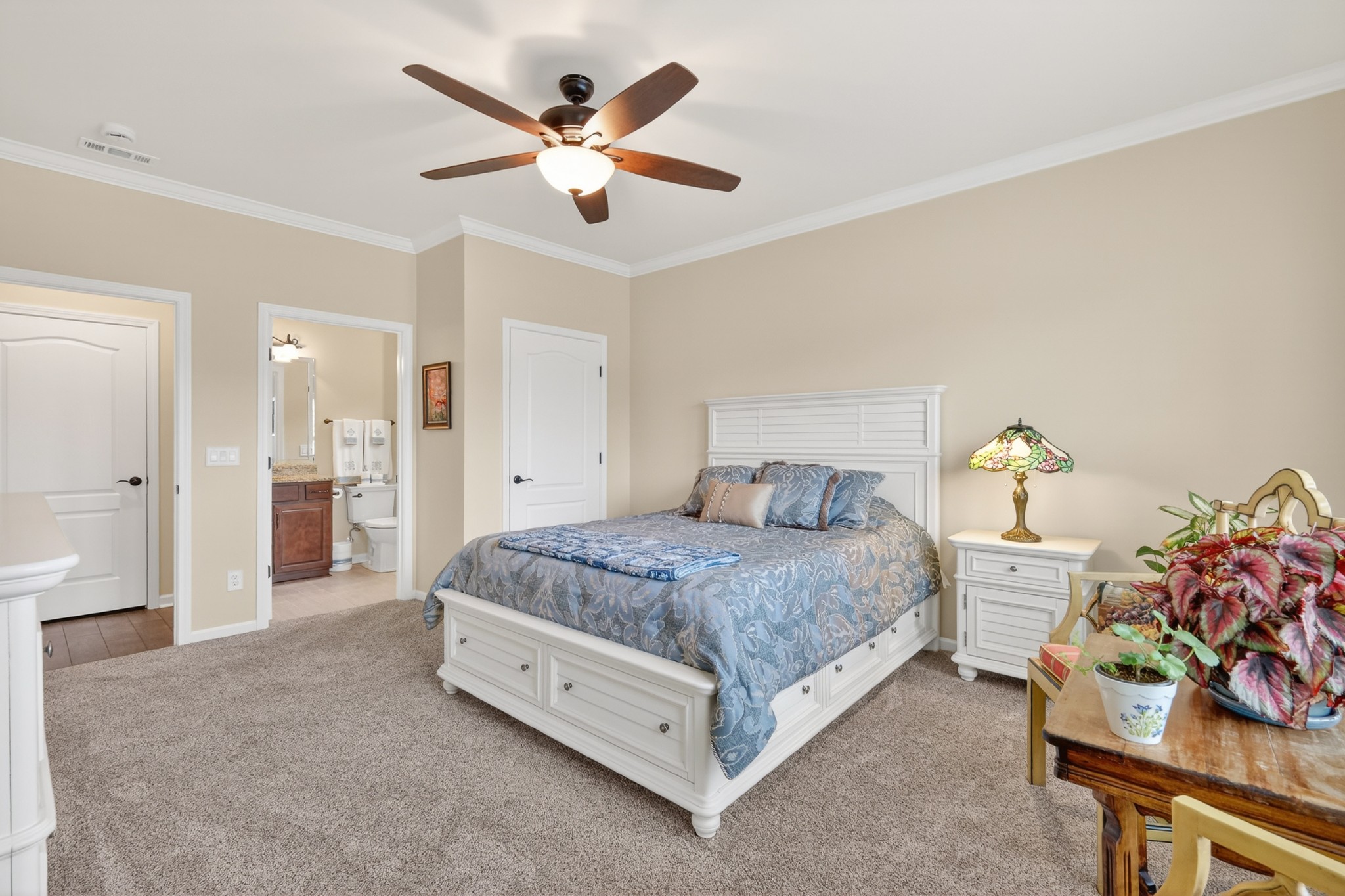 1024 Coffee Ridge Spring Hill, TN 37174 - Photo 23 of 46 a spacious bedroom with a bed and a chandelier