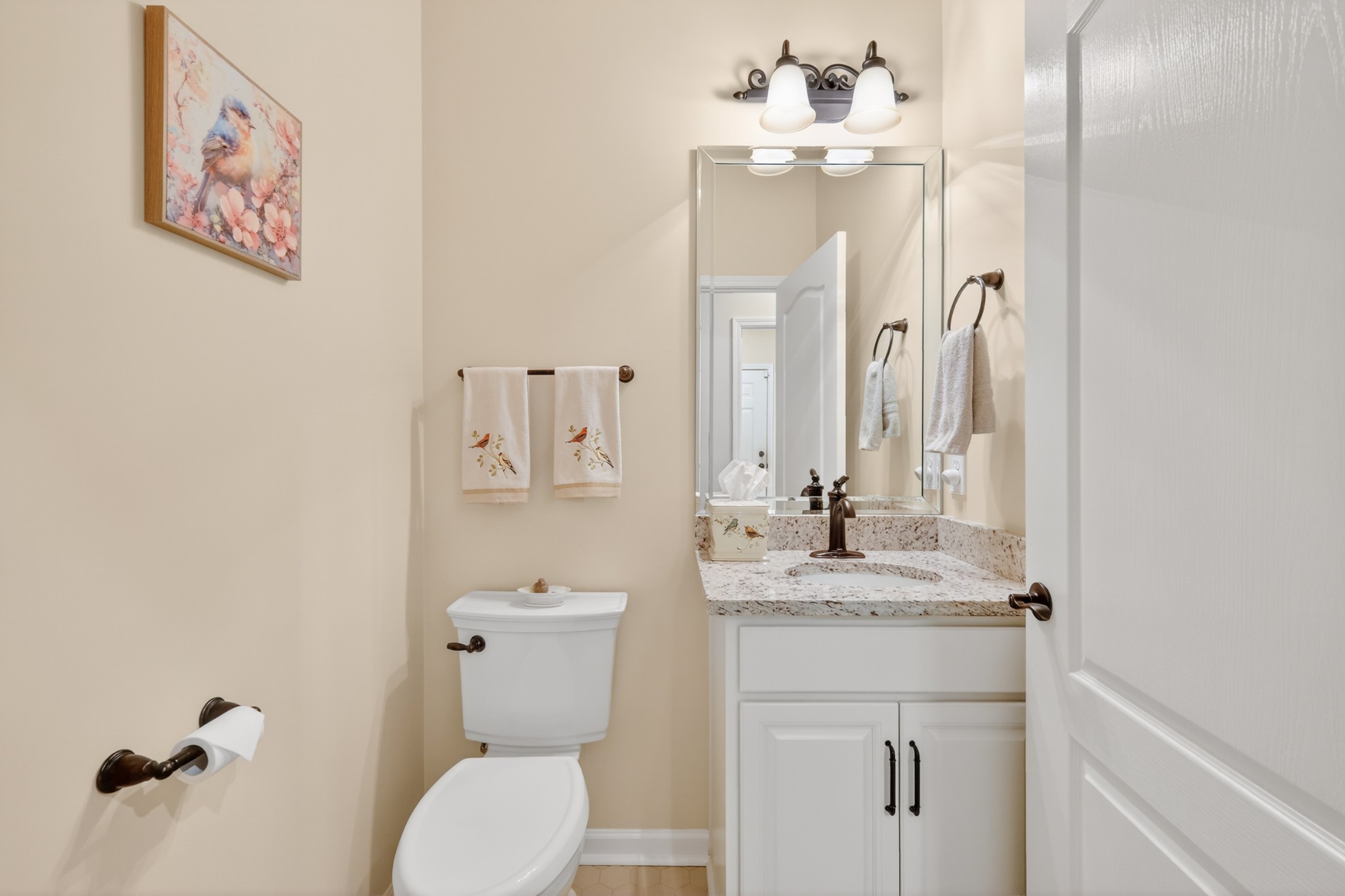 1024 Coffee Ridge Spring Hill, TN 37174 - Photo 28 of 46 a bathroom with a sink vanity mirror and toilet