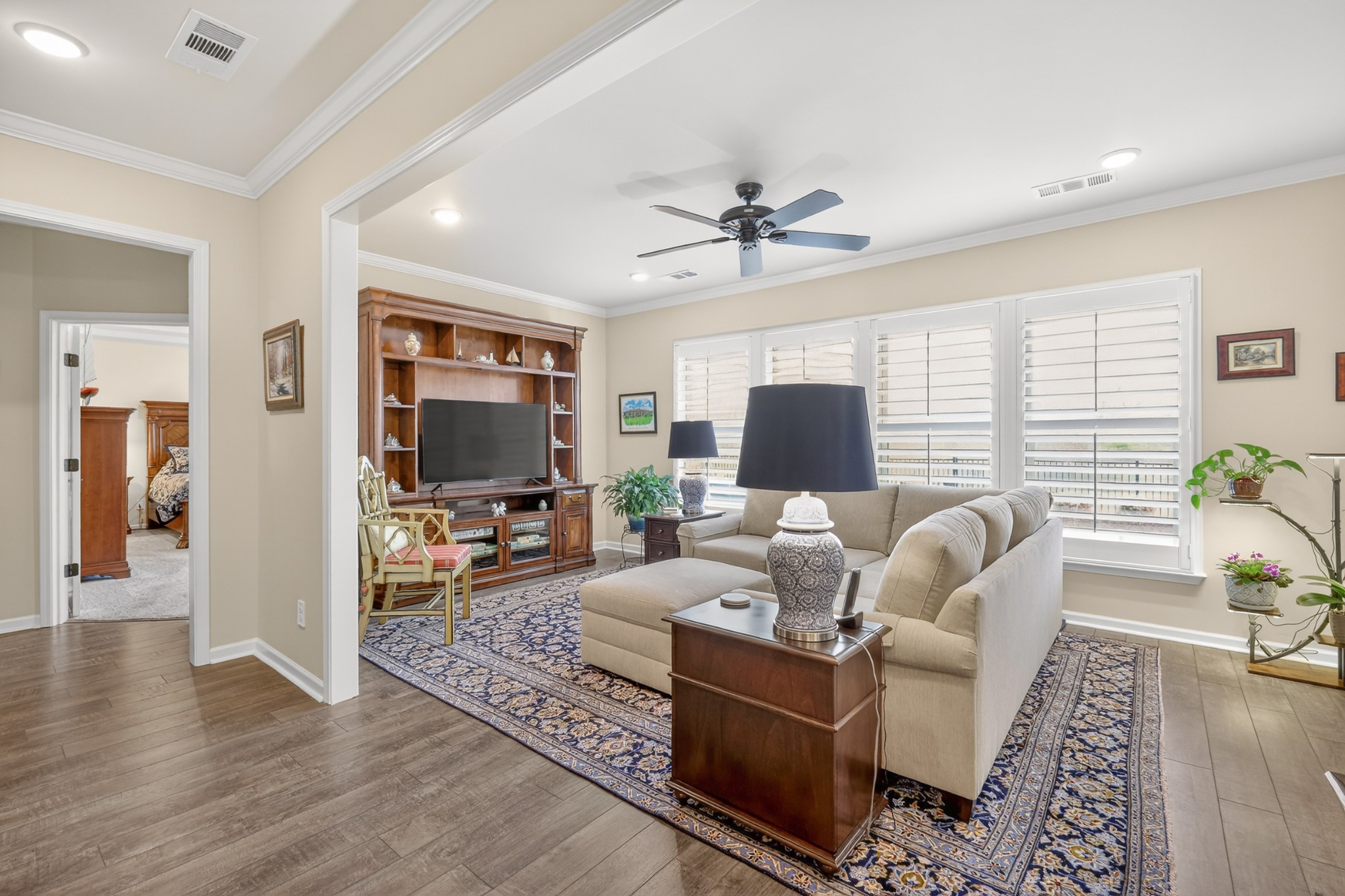 1024 Coffee Ridge Spring Hill, TN 37174 - Photo 29 of 46 a living room with furniture a flat screen tv and a large window
