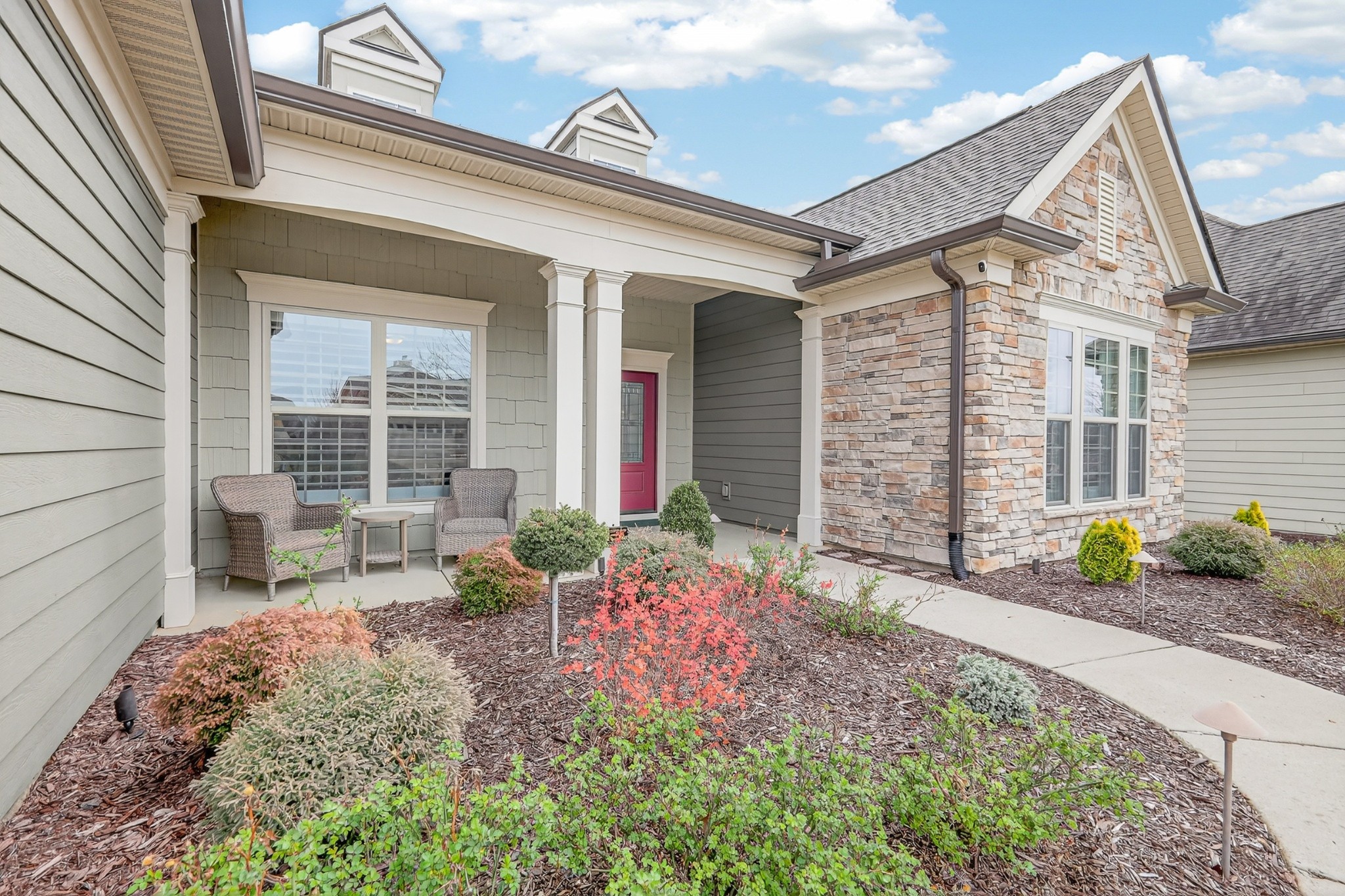 1024 Coffee Ridge Spring Hill, TN 37174 - Photo 3 of 46 a front view of a house with garden