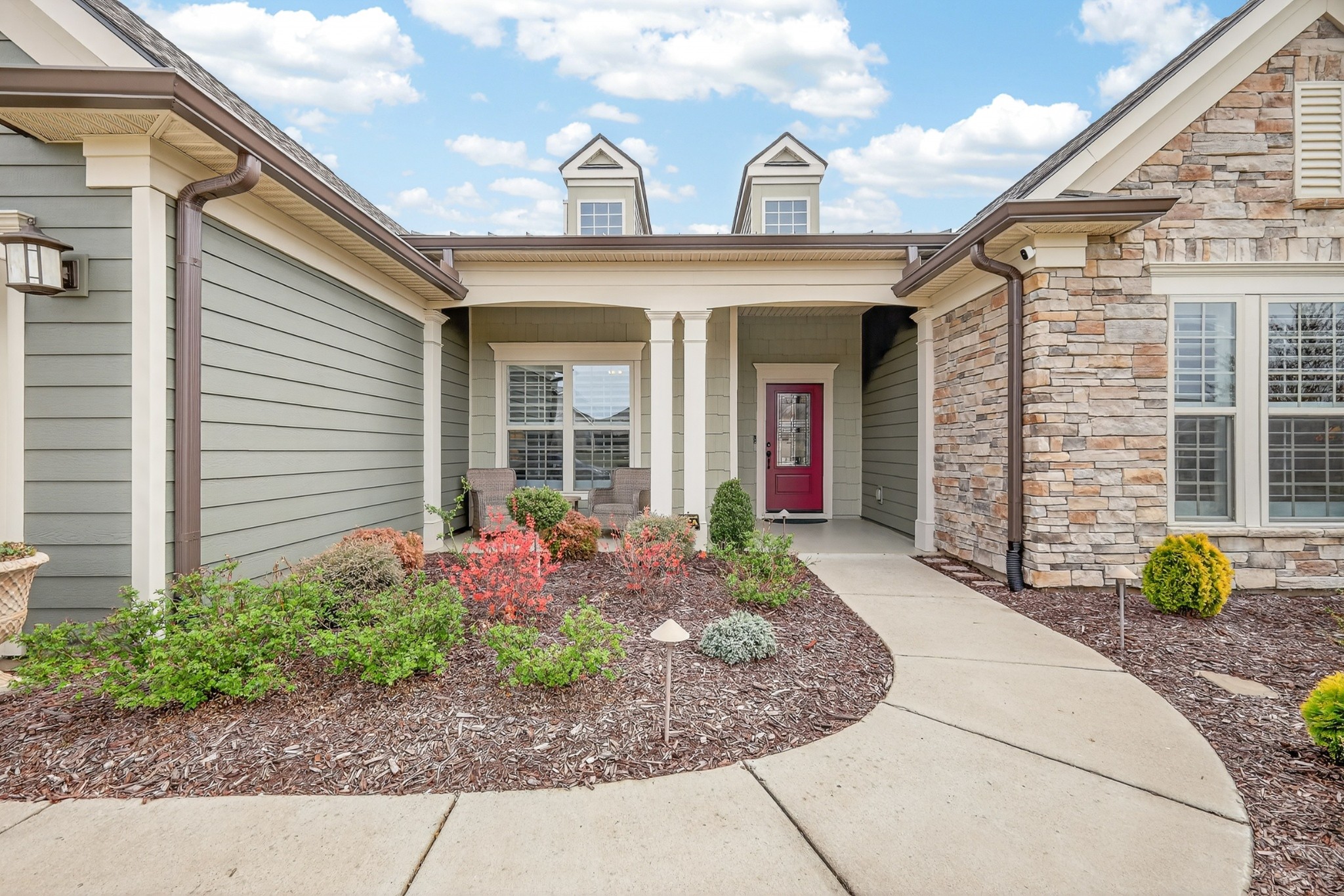 1024 Coffee Ridge Spring Hill, TN 37174 - Photo 4 of 46 a front view of a house with garden