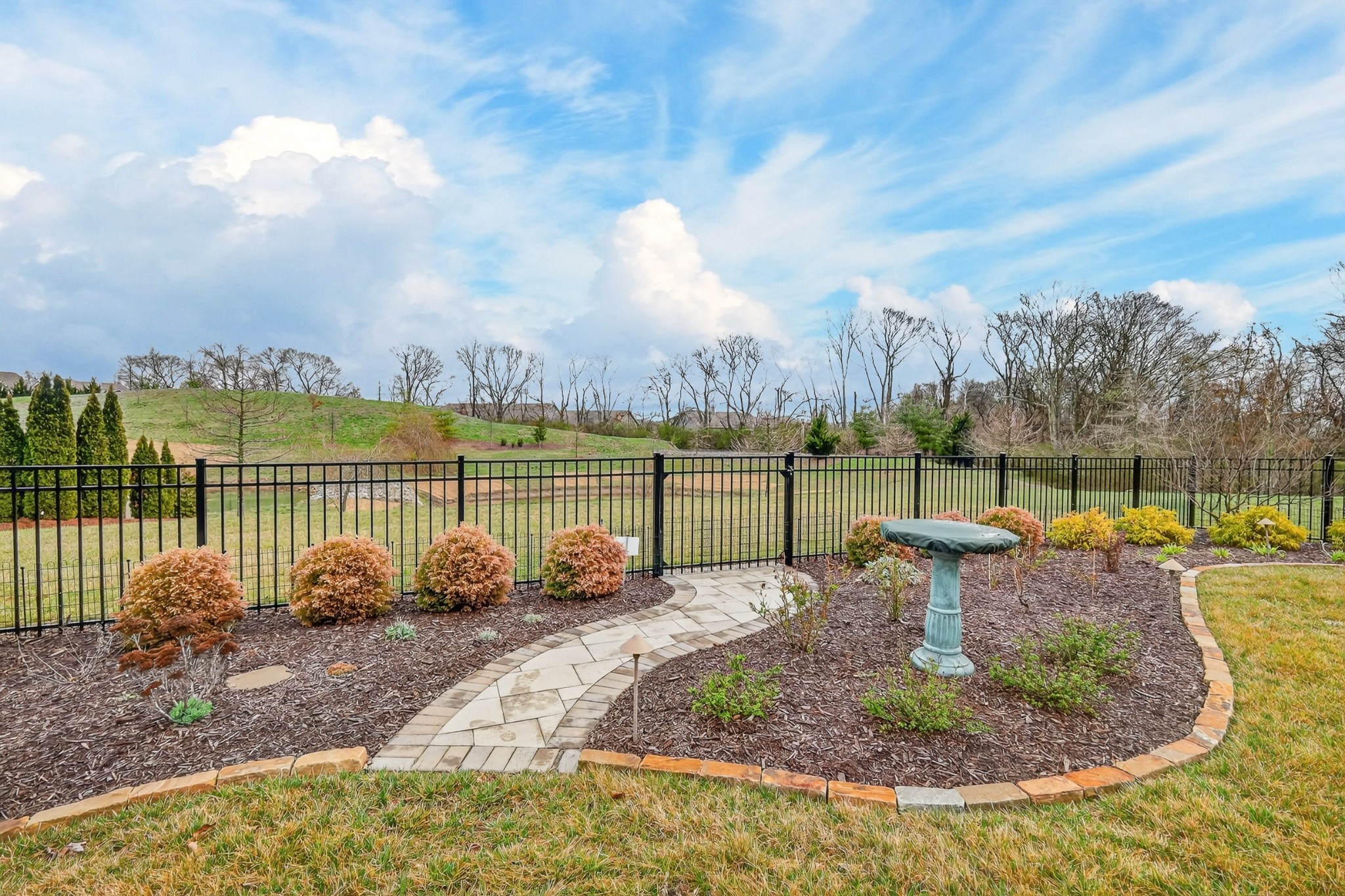 1024 Coffee Ridge Spring Hill, TN 37174 - Photo 41 of 46 a view of a lake with a house in the background