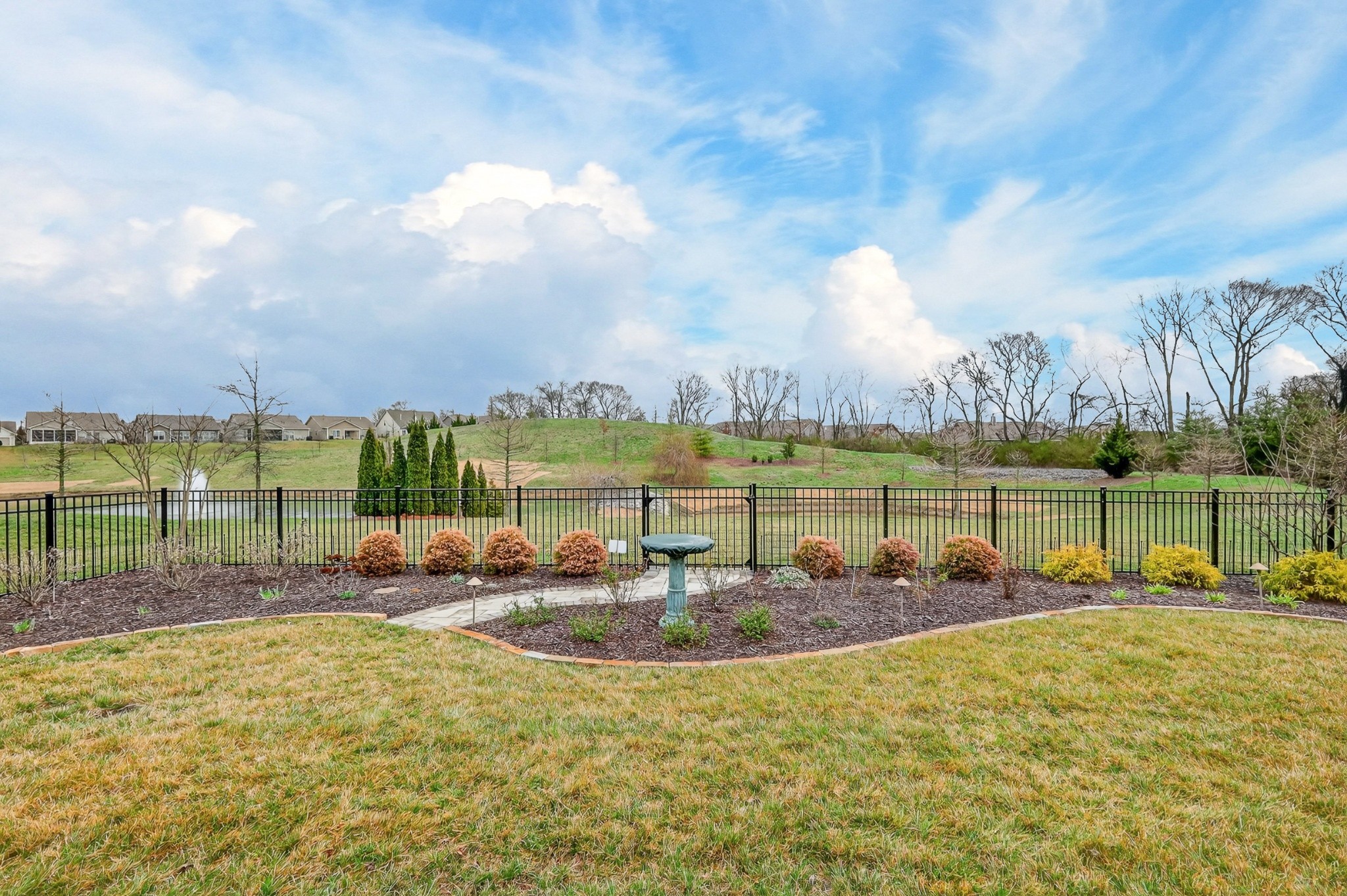 1024 Coffee Ridge Spring Hill, TN 37174 - Photo 43 of 46 a view of a lake with houses in the back