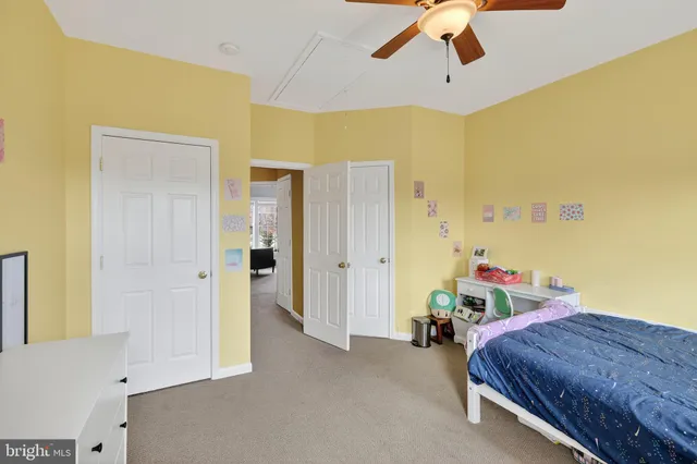 a view of a kitchen with a sink and a refrigerator