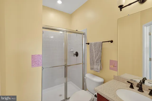 a front view of a house with a garden and plants