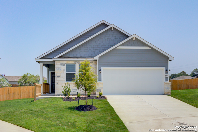 a front view of house with yard and outdoor seating