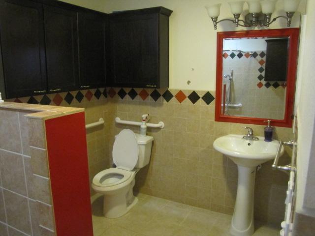 1355 Panorama Ridge Road Oceanside, CA 92056 - Photo 14 of 25 Enlarged ADA compliat bathroom with newer cabinets. 36 inch wide door access.