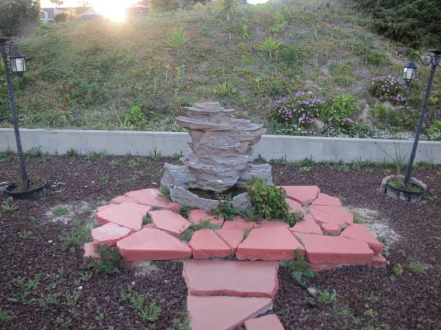 1355 Panorama Ridge Road Oceanside, CA 92056 - Photo 22 of 25 Volcanic rock in backyard. Even has a fountain and lights